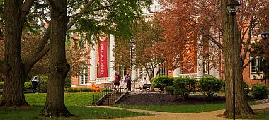 Image of Seibert Hall in the fall. Susquehanna students are walking in front of the building.